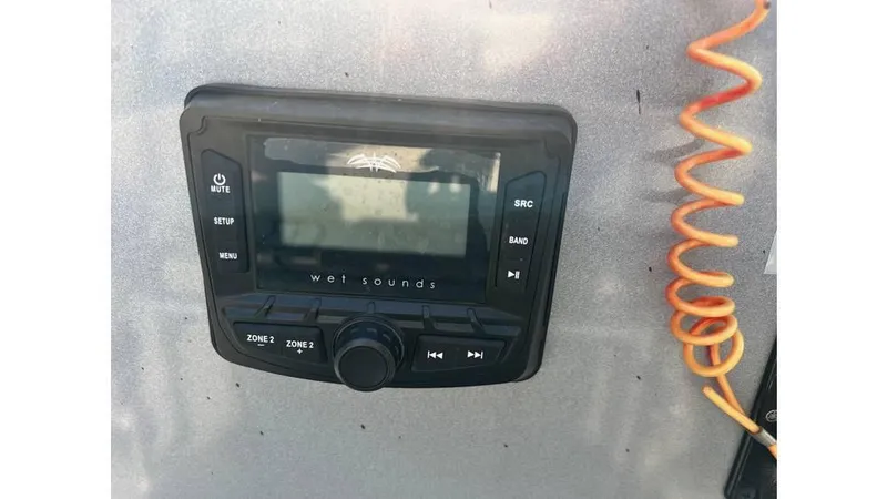 Slide: The Image of 2023 Express H22B audio system with Wet Sounds control panel and coiled cable. - 7