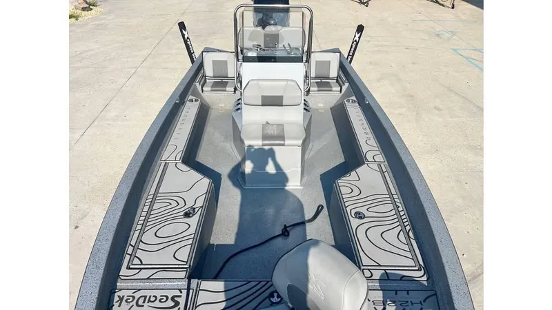 Slide: The Image of 2023 Express H22B boat with sleek design and spacious deck layout. - 8