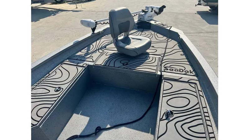 Slide: The Image of 2023 Express H22B boat deck with SeaDek flooring and swivel seat. - 9