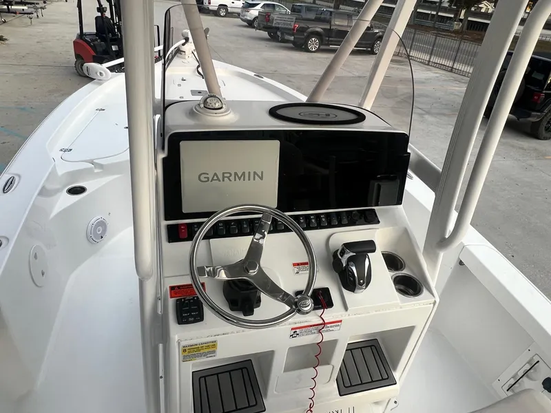 Slide: The Image of 2022 Sea Hunt BX 25 BR boat console with Garmin navigation system and steering wheel. - 11