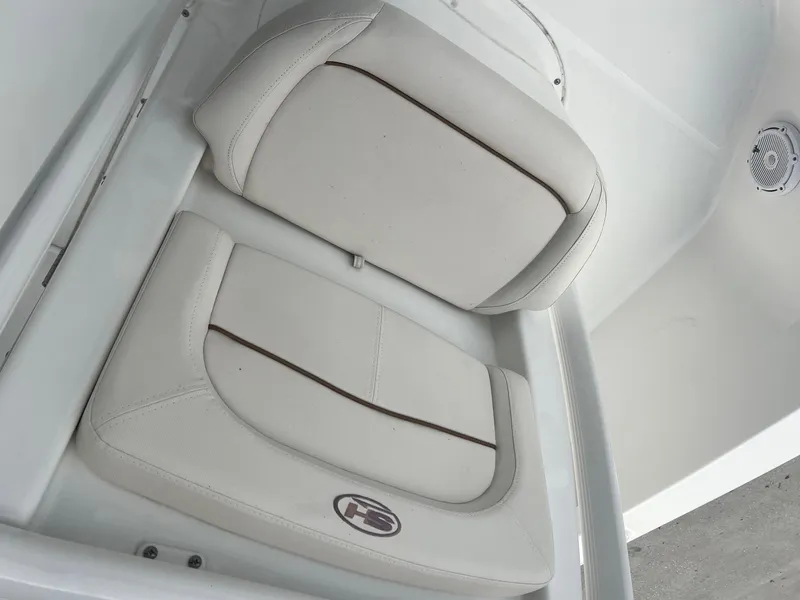 Slide: The Image of 2022 Sea Hunt BX 25 BR boat seat with beige upholstery and logo detail. - 16