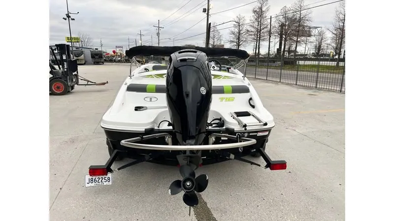 Slide: The Image of 2022 Tahoe T16 boat with outboard motor, parked on concrete lot. - 5