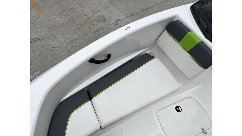 Slide: The Image of 2022 Tahoe T16 boat interior with white and green cushioned seating. - 9