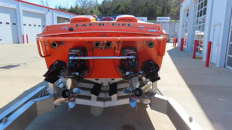 Slide: The Image of 2003 Cigarette 38 Top Gun boat with dual engines on a trailer. - 10