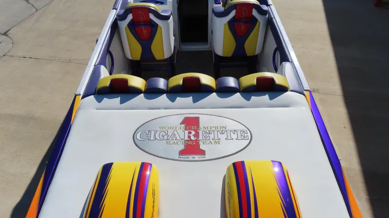 Slide: The Image of 2003 Cigarette 38 Top Gun boat interior with colorful seats and logo. - 19