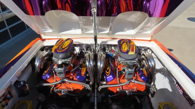 Slide: The Image of 2003 Cigarette 38 Top Gun boat engine with vibrant custom paint. - 2
