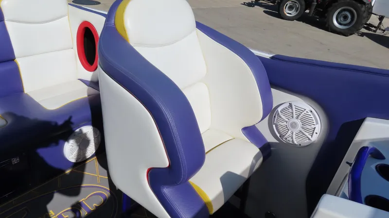 Slide: The Image of 2003 Cigarette 38 Top Gun boat interior with blue and white seating and speaker. - 23