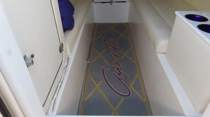 Slide: The Image of Interior of 2003 Cigarette 38 Top Gun boat with custom flooring and seating. - 27