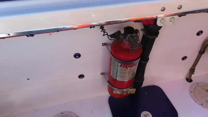 Slide: The Image of Fire extinguisher mounted inside a 2003 Cigarette 38 Top Gun boat. - 31