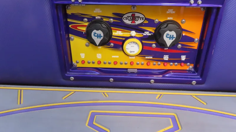 Slide: The Image of Control panel of a 2003 Cigarette 38 Top Gun boat with vibrant design. - 7