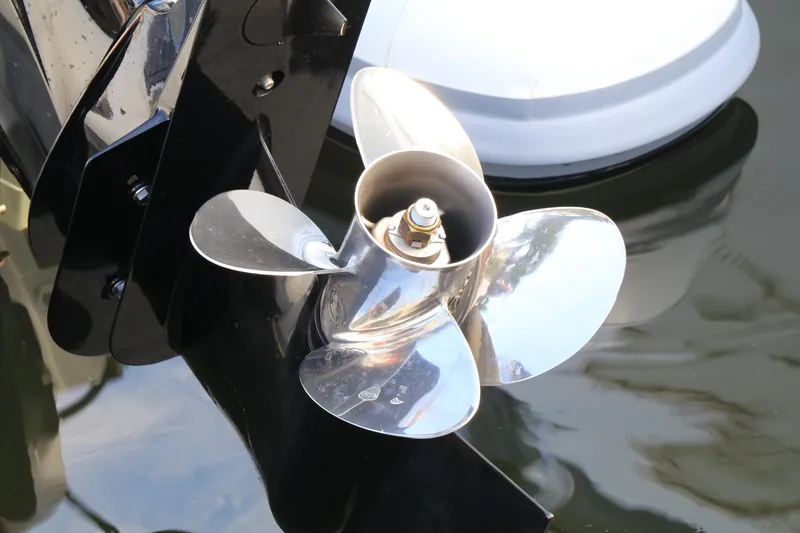 Slide: The Image of Shiny propeller of 2023 Highfield SP390 boat reflecting sunlight on water. - 10