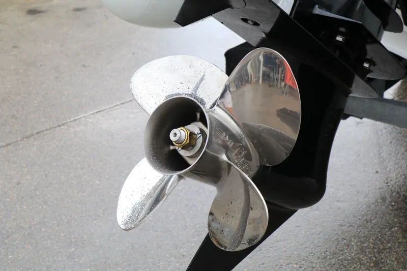 Slide: The Image of 2023 Highfield SP390 boat propeller, shiny metal blades, close-up view. - 11