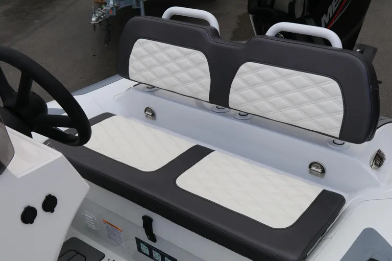 Slide: The Image of 2023 Highfield SP390 boat interior with quilted white and gray seating. - 18