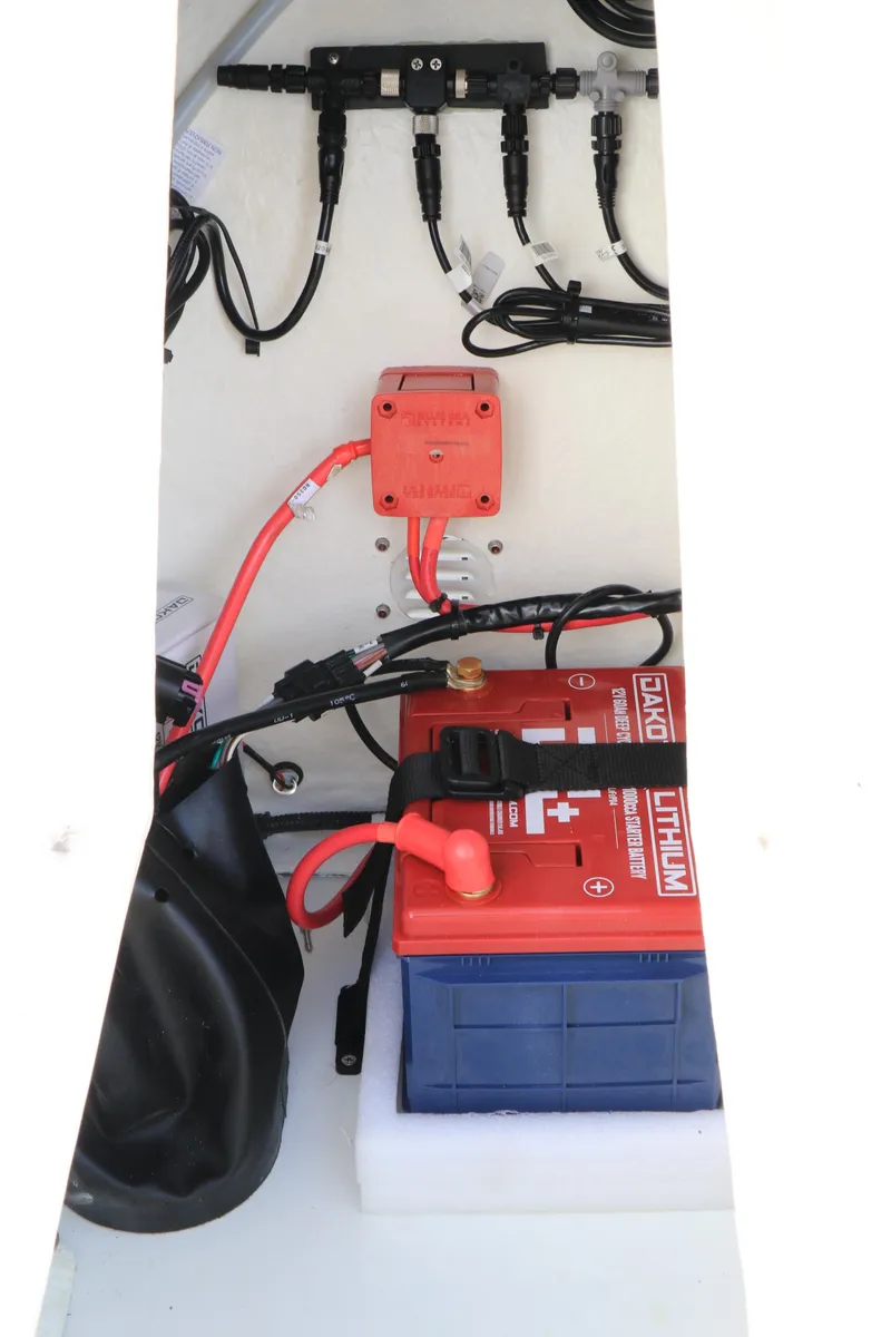 Slide: The Image of 2023 Highfield SP390 boat battery compartment with wiring and connections. - 28