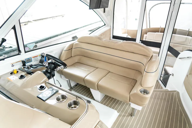 Slide: The Image of 2016 Formula 45 Yacht interior with beige seating and modern helm controls. - 16