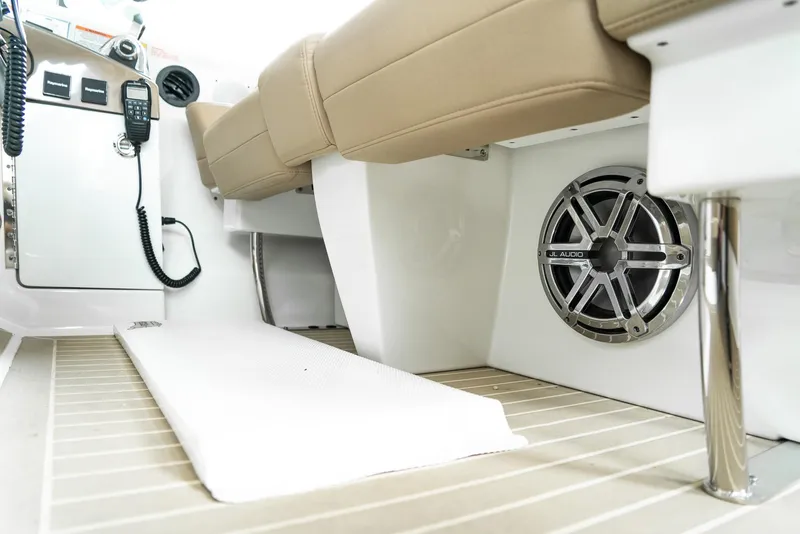 Slide: The Image of 2016 Formula 45 Yacht interior with beige seating, speaker, and control panel. - 19