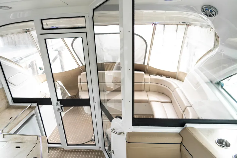 Slide: The Image of Interior view of a 2016 Formula 45 Yacht with beige seating and glass doors. - 23