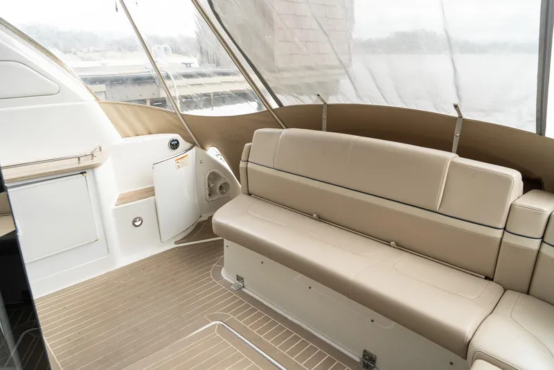 Slide: The Image of 2016 Formula 45 Yacht interior with beige seating and wood flooring. - 27