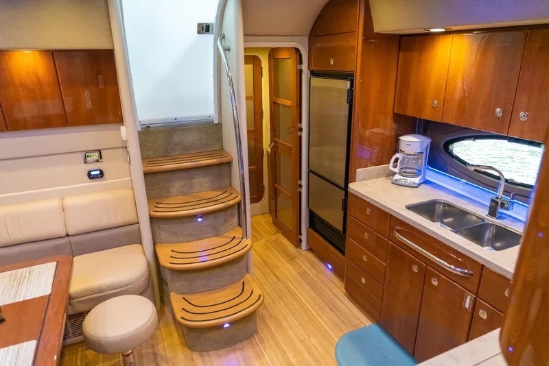 Slide: The Image of Luxurious interior of a 2016 Formula 45 Yacht with wooden cabinetry and modern amenities. - 37