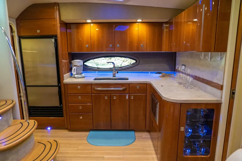 Slide: The Image of Luxurious kitchen interior of 2016 Formula 45 Yacht with wood cabinetry and modern appliances. - 38