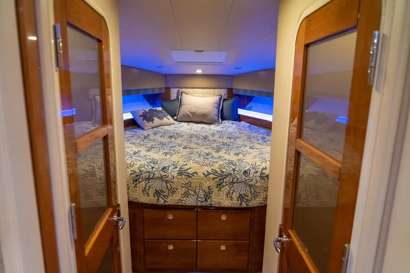 Slide: The Image of Luxurious bedroom interior of 2016 Formula 45 Yacht with elegant bedding and wooden accents. - 44