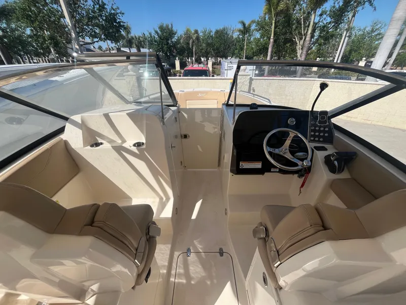 Slide: The Image of 2023 Scout 255 Dorado boat interior with dual seating and steering console. - 13