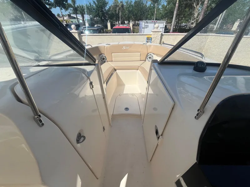 Slide: The Image of 2023 Scout 255 Dorado boat interior with beige seating and sleek design. - 18