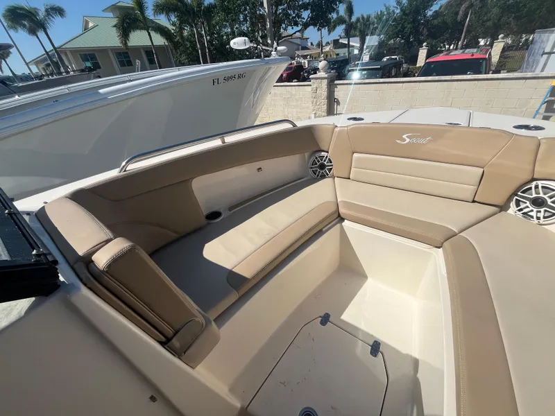 Slide: The Image of 2023 Scout 255 Dorado boat interior with tan seating and speakers. - 21