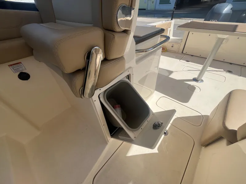 Slide: The Image of 2023 Scout 255 Dorado boat interior with open storage compartment. - 31