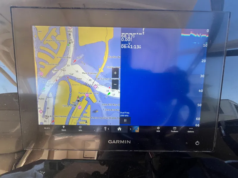 Slide: The Image of Garmin navigation display on 2023 Scout 255 Dorado boat, showing map and data. - 32