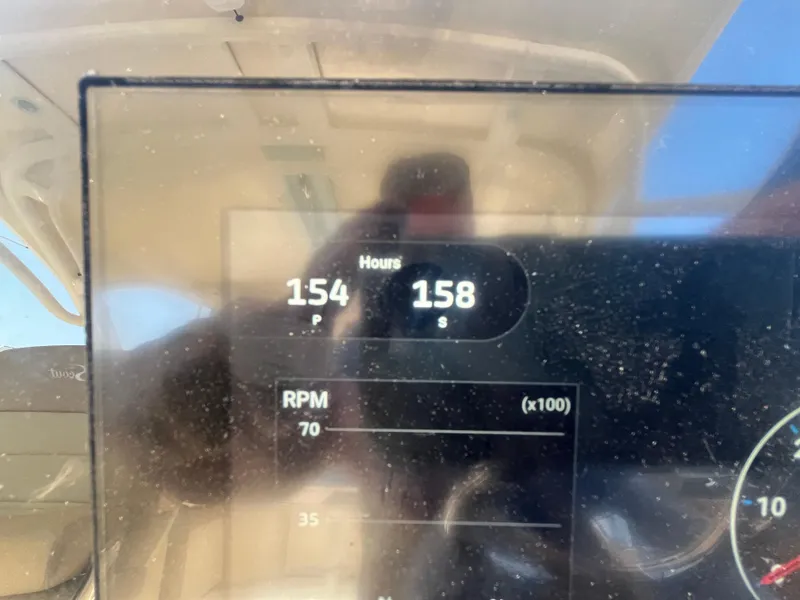 Slide: The Image of Dashboard display of a 2023 Scout 255 Dorado showing engine hours and RPM. - 34