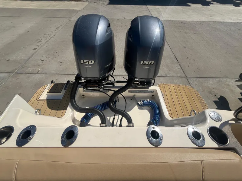 Slide: The Image of 2023 Scout 255 Dorado boat with dual 150 horsepower engines, rear view. - 35