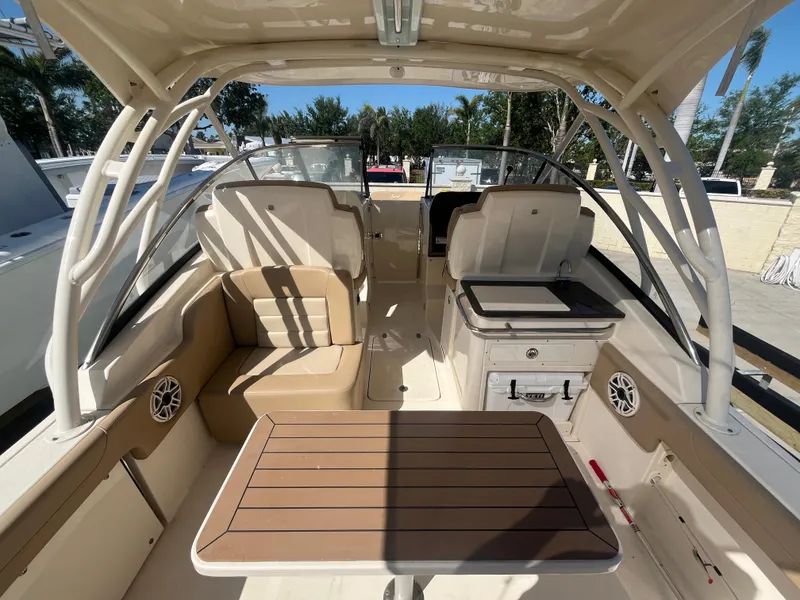 Slide: The Image of 2023 Scout 255 Dorado boat interior with seating and table, showcasing luxury design. - 8