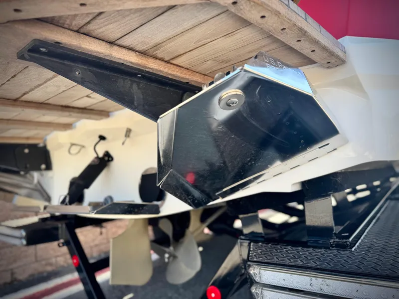 Slide: The Image of 2018 MasterCraft XT22 boat trailer with propeller and metal components visible. - 10