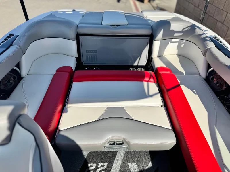 Slide: The Image of 2018 MasterCraft XT22 boat interior with red and white seating. - 20