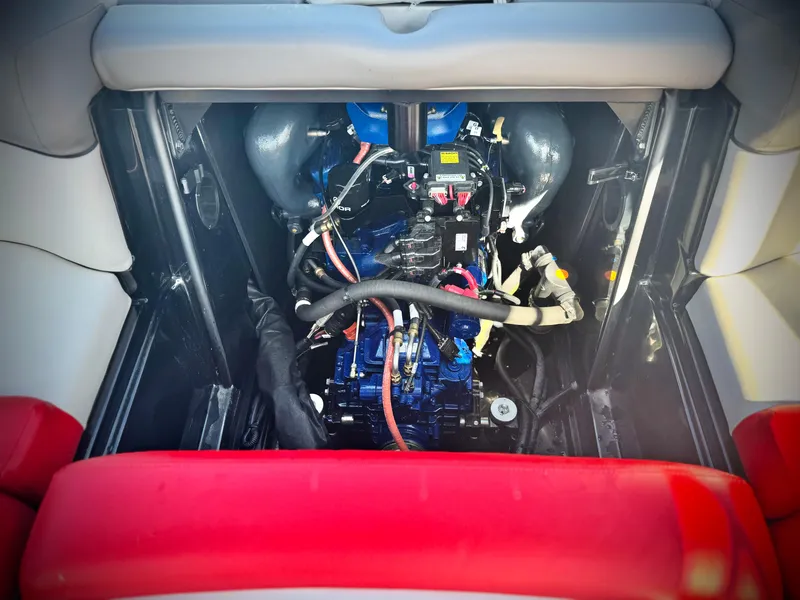 Slide: The Image of Engine compartment of a 2018 MasterCraft XT22 boat, showcasing detailed mechanical components. - 24