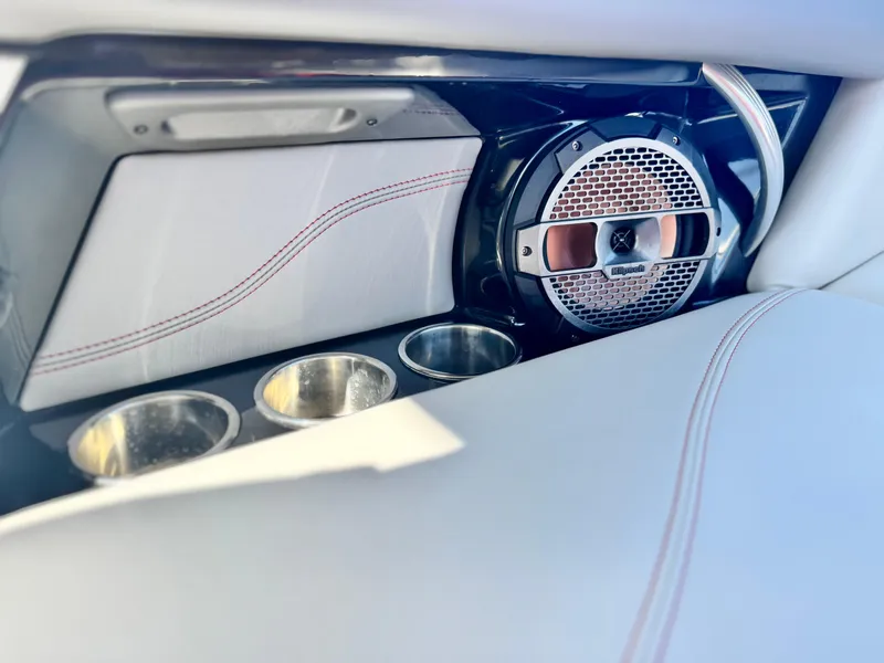 Slide: The Image of Interior of 2018 MasterCraft XT22 boat with speaker and cup holders. - 27