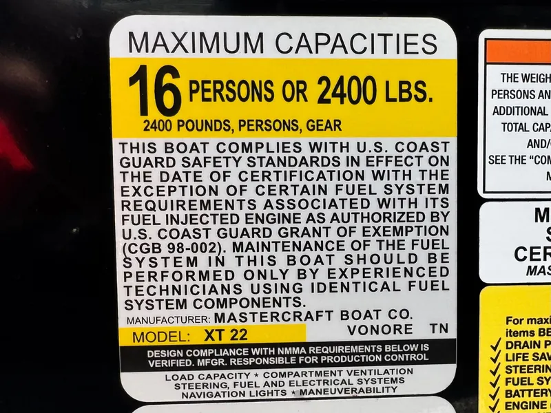 Slide: The Image of Maximum capacity label for 2018 MasterCraft XT22 boat: 16 persons or 2400 lbs. - 32