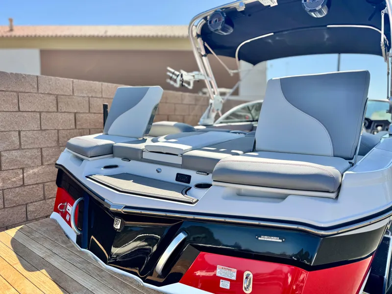 Slide: The Image of 2018 MasterCraft XT22 boat with sleek seating and modern design. - 7