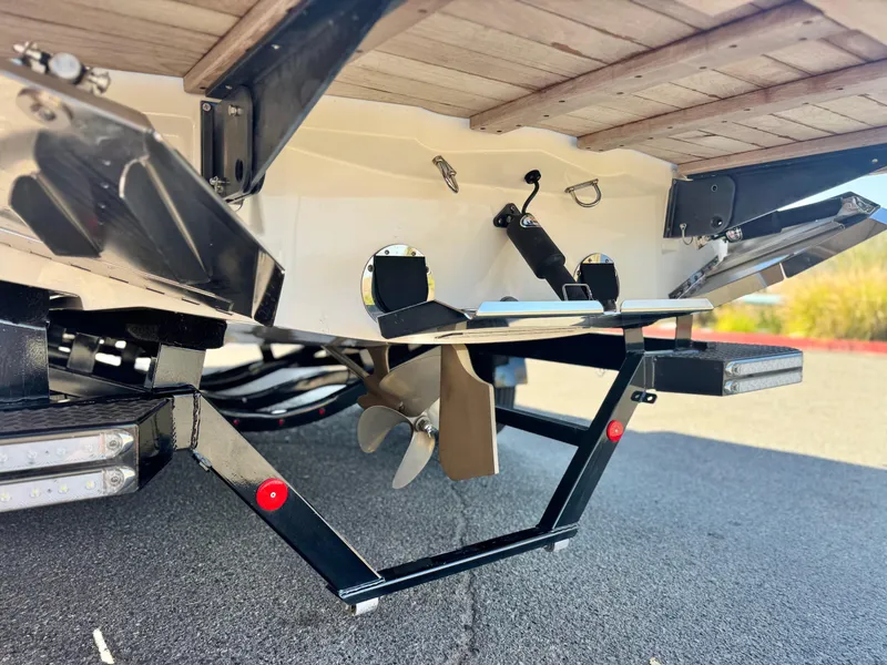 Slide: The Image of 2018 MasterCraft XT22 boat underside showing propeller and rudder details. - 9