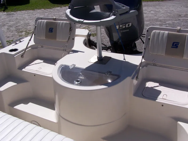 Slide: The Image of 2014 Carolina Skiff DLV 218 boat interior with seating and steering console. - 10