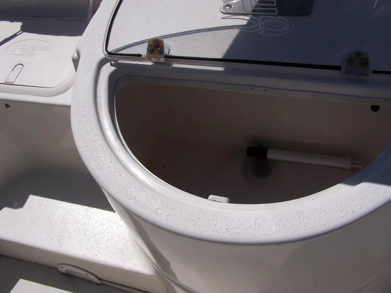 Slide: The Image of 2014 Carolina Skiff DLV 218 boat storage compartment with open lid. - 11