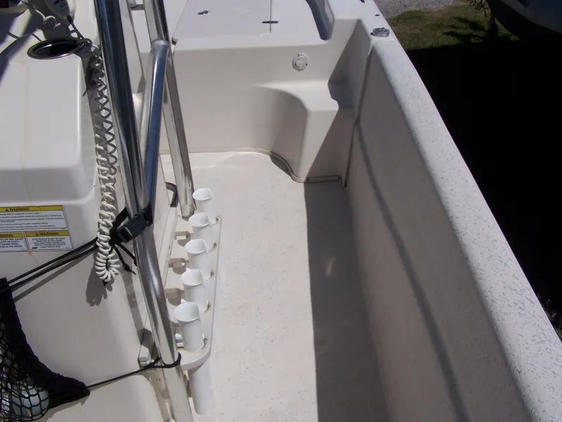 Slide: The Image of 2014 Carolina Skiff DLV 218 interior with rod holders and console details. - 13