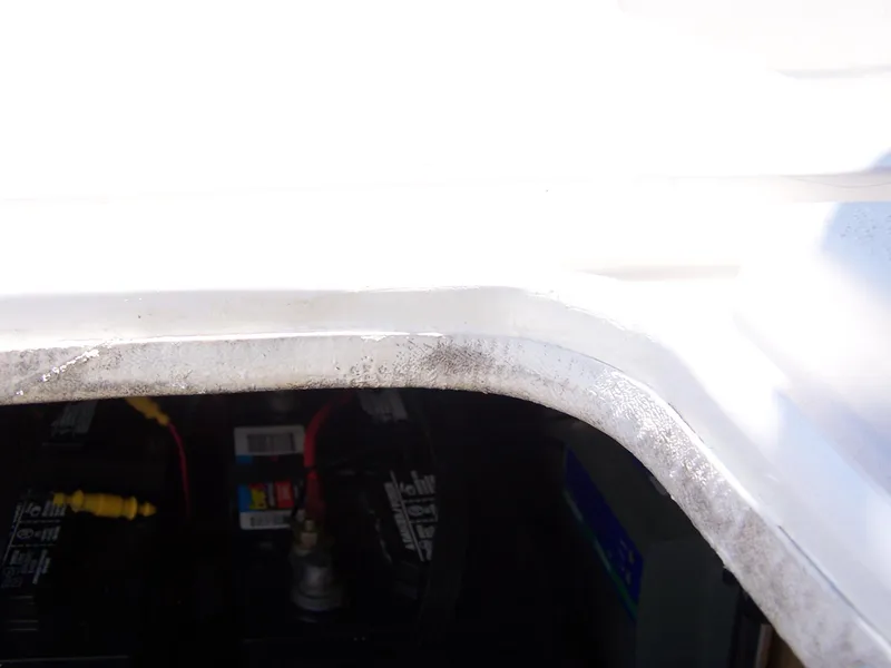 Slide: The Image of Battery compartment of a 2014 Carolina Skiff DLV 218 boat. - 15