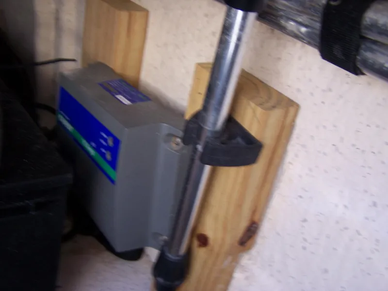 Slide: The Image of 2014 Carolina Skiff DLV 218 interior detail with mounted equipment and wooden support. - 16