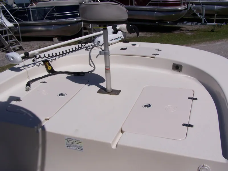 Slide: The Image of 2014 Carolina Skiff DLV 218 boat deck with storage compartments and seating. - 5