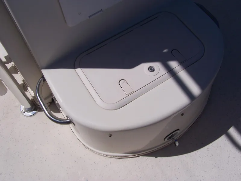 Slide: The Image of 2014 Carolina Skiff DLV 218 boat storage compartment with handle and latch. - 8