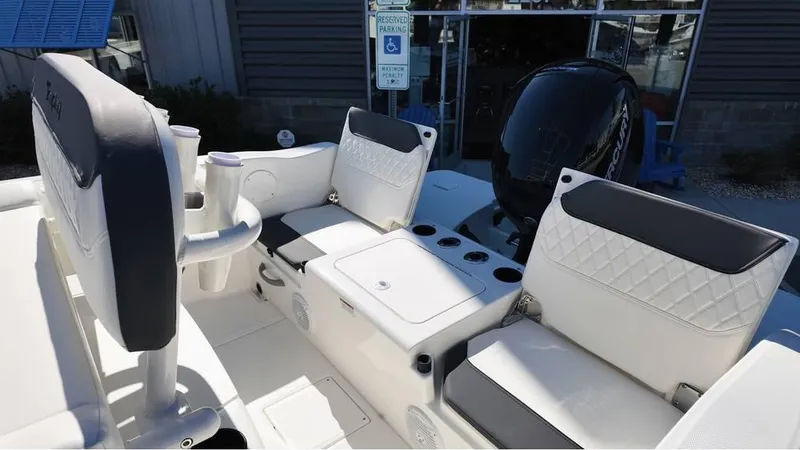 Slide: The Image of 2025 Bayliner Trophy 20 boat interior with seating and motor, showcasing modern design. - 1