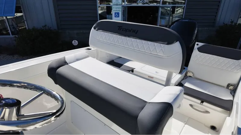 Slide: The Image of 2025 Bayliner Trophy 20 boat interior with sleek seating and steering wheel. - 4