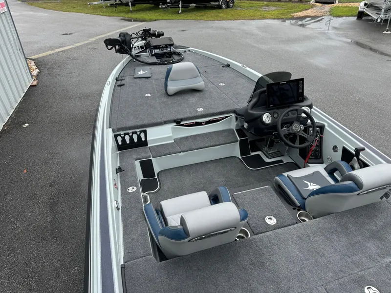 Slide: The Image of 2025 Phoenix 721 ZXL boat interior with modern seating and advanced dashboard controls. - 11